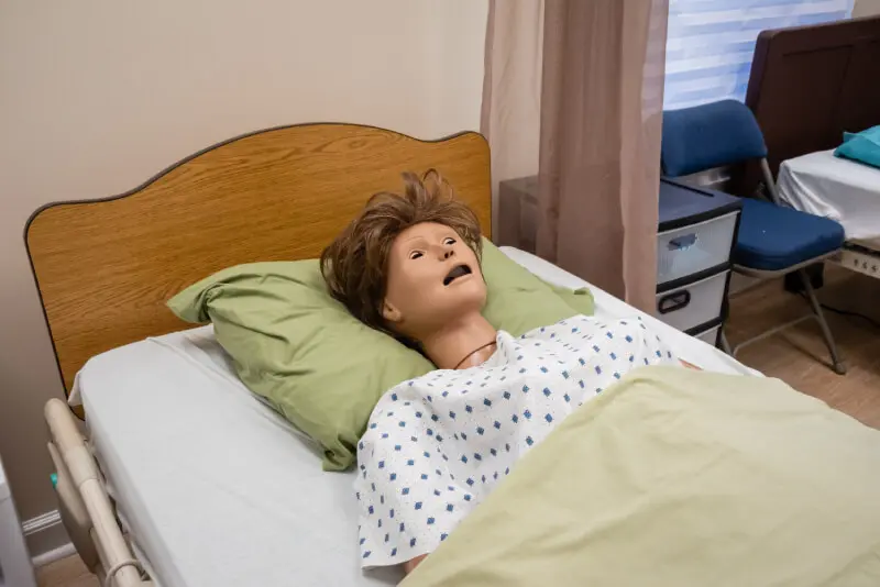 A mannequin lying on the bed